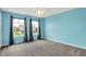 Bedroom with bright walls, neutral carpet, with two windows showing the neighborhood at 1384 Horse Shoe, Greenwood, IN 46143