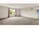 Large bedroom with neutral carpet, bright window with nature view, and white walls at 1384 Horse Shoe, Greenwood, IN 46143