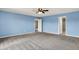 The bedroom features neutral carpeting and adjacent rooms, perfect for relaxation and privacy at 1384 Horse Shoe, Greenwood, IN 46143