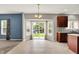 Open dining area with sliding glass doors leading to the backyard and connected to the kitchen with center island at 1384 Horse Shoe, Greenwood, IN 46143