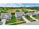 Two-story home with a brick facade, a front yard, a two-car garage, landscaping, and a driveway at 1384 Horse Shoe, Greenwood, IN 46143