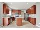 Stylish kitchen with stainless steel appliances, central island, and adjacent storage space for optimal organization at 1384 Horse Shoe, Greenwood, IN 46143