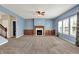 Spacious living room with a classic fireplace and built-in wood cabinets at 1384 Horse Shoe, Greenwood, IN 46143