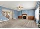 Cozy living room featuring a fireplace with built-in wood cabinets and natural light at 1384 Horse Shoe, Greenwood, IN 46143