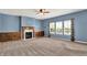 Living room with built-in cabinets surrounding a cozy fireplace and natural light at 1384 Horse Shoe, Greenwood, IN 46143