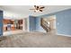 Open floor plan showcasing the living room connected to the kitchen and staircase at 1384 Horse Shoe, Greenwood, IN 46143