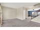 Spacious living room features neutral walls, plush carpeting, and staircase in view at 1384 Horse Shoe, Greenwood, IN 46143