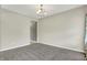 Empty living room with neutral walls, carpet, and chandelier at 1384 Horse Shoe, Greenwood, IN 46143