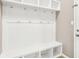 Mudroom includes a bench and coat hooks for organization at 1384 Horse Shoe, Greenwood, IN 46143