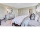 Bright bedroom features neutral tones, carpet flooring, and an ensuite bathroom at 15298 Farrington Way, Fishers, IN 46037