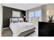 This spacious main bedroom features neutral tones and a large window at 15298 Farrington Way, Fishers, IN 46037