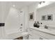This well lit bathroom has a shower-tub, undermount sink, white vanity, and decorative accents at 15344 Cardonia Rd, Fishers, IN 46037