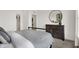 Comfortable bedroom features a dresser, mirror, and wardrobe in a bright, inviting space at 15344 Cardonia Rd, Fishers, IN 46037