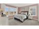 Charming bedroom with large windows allowing in ample natural light and neutral-toned decor at 15344 Cardonia Rd, Fishers, IN 46037