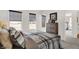 Cozy bedroom offers natural light, carpet floors, dark window shades, and a sports-themed décor at 15344 Cardonia Rd, Fishers, IN 46037