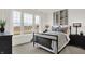 Cozy bedroom featuring a large window, neutral decor, and modern furnishings at 15344 Cardonia Rd, Fishers, IN 46037