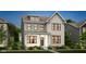 New home features brick facade, black framed windows, covered porch, and professionally landscaped front yard at 15344 Cardonia Rd, Fishers, IN 46037