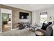 Cozy living room with wood-look accent wall and comfortable seating that opens to a bedroom at 15344 Cardonia Rd, Fishers, IN 46037