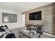 Modern living room with wood accent wall, TV, coffee table, and stylish decor at 15344 Cardonia Rd, Fishers, IN 46037