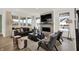 Bright living room showcasing large windows, a fireplace, modern furniture and hardwood flooring at 15344 Cardonia Rd, Fishers, IN 46037