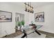 Well-lit office features modern decor, a glass desk, and contemporary artwork at 15344 Cardonia Rd, Fishers, IN 46037