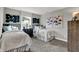 Cozy bedroom with two twin beds, stylish artwork, and ample natural light for a comfortable space at 15360 Cardonia Rd, Fishers, IN 46037
