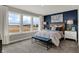 Inviting bedroom with large windows, a comfortable bed, and elegant decor, creating a relaxing atmosphere at 15360 Cardonia Rd, Fishers, IN 46037
