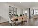 Elegant dining room with a long table, comfortable seating, and stylish decor at 15360 Cardonia Rd, Fishers, IN 46037