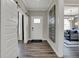 Stylish home entryway features wood floors, barn door, and decorative wall art at 15360 Cardonia Rd, Fishers, IN 46037