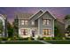Beautiful two-story home with gray siding, black trim windows, and professionally landscaped front yard at 15360 Cardonia Rd, Fishers, IN 46037