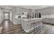 Stylish kitchen featuring a large island with seating, stainless steel appliances, and sleek finishes at 15360 Cardonia Rd, Fishers, IN 46037
