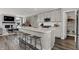 Beautiful kitchen with a spacious island, stainless steel appliances, and a view of the living area at 15360 Cardonia Rd, Fishers, IN 46037