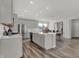 Bright kitchen with stainless appliances, large island, and seamless transition to the dining area at 15360 Cardonia Rd, Fishers, IN 46037