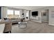Bright living room with neutral colors, large windows, a comfortable sofa, and a modern coffee table at 15360 Cardonia Rd, Fishers, IN 46037