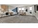 Bright living room featuring large windows, comfortable seating, and stylish decor for relaxing and entertaining at 15360 Cardonia Rd, Fishers, IN 46037