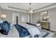 Spacious main bedroom with a sofa, soft lighting, and artwork creating a comfortable and stylish space at 15360 Cardonia Rd, Fishers, IN 46037