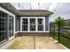 Charming backyard patio features exposed aggregate concrete and decorative privacy screen at 15596 Edenvale Dr, Westfield, IN 46074