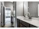 Bathroom featuring a white sink with quartz countertop and brushed nickel faucet with wood look floors at 15596 Edenvale Dr, Westfield, IN 46074