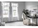 Bright bedroom with large windows, a desk area, and neutral decor at 15596 Edenvale Dr, Westfield, IN 46074