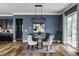 Dining room with modern lighting, stylish chairs, and sliding glass doors at 15596 Edenvale Dr, Westfield, IN 46074