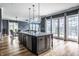 Open kitchen view with island, stainless steel appliances, and direct access to the dining and living areas at 15596 Edenvale Dr, Westfield, IN 46074