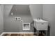 Laundry room with gray walls, wood look floors, and a sink at 15596 Edenvale Dr, Westfield, IN 46074