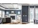 Bright living room with fireplace, built-in shelves, and direct access to the outdoors at 15596 Edenvale Dr, Westfield, IN 46074