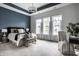 Serene primary bedroom with large windows, tray ceiling, and comfortable furnishings at 15596 Edenvale Dr, Westfield, IN 46074