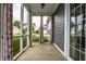 Covered porch showcasing privacy curtains and an inviting outdoor seating area at 15596 Edenvale Dr, Westfield, IN 46074