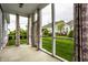 Inviting screened porch with backyard view, offering a serene outdoor living space at 15596 Edenvale Dr, Westfield, IN 46074