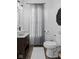Stylish half-bathroom featuring hardwood floors, vessel sink, and decorative wall art at 170 W Broadway St, Greenwood, IN 46142