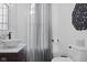 Elegant half-bathroom with vessel sink, modern fixtures, and decorative mirror at 170 W Broadway St, Greenwood, IN 46142
