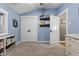 Neutral bedroom with door to next room and built in book shelves at 170 W Broadway St, Greenwood, IN 46142