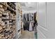 Walk-in closet featuring custom shelving for clothes and shoes at 170 W Broadway St, Greenwood, IN 46142